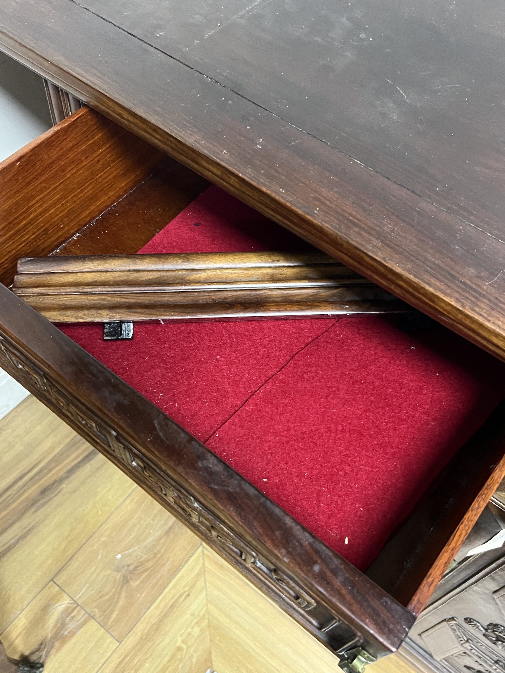 An Asian hardwood side cabinet, width 134cm, depth 44cm, height 84cm